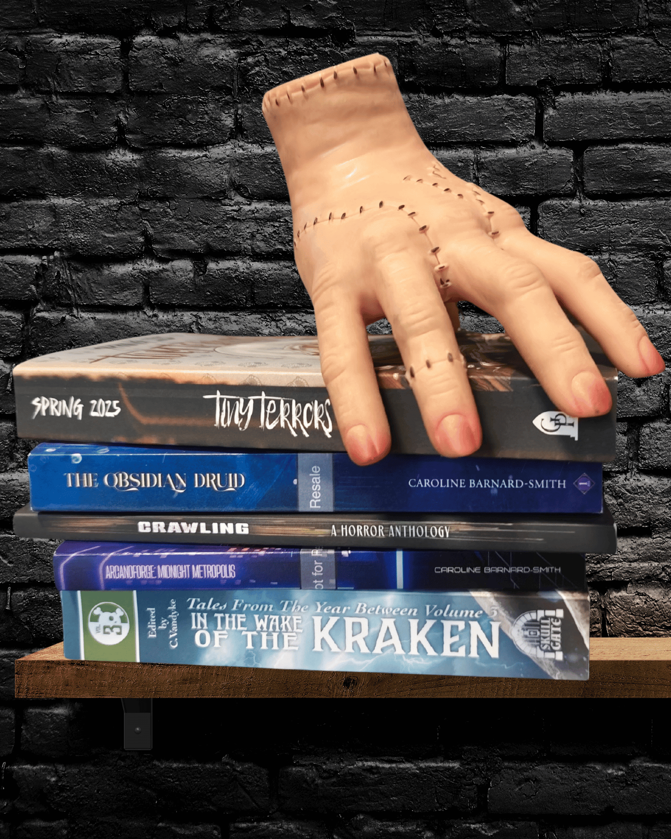 Thing guards various books written by Caroline Barnard-Smith and some anthologies she's been featured in. Thank you, Thing.